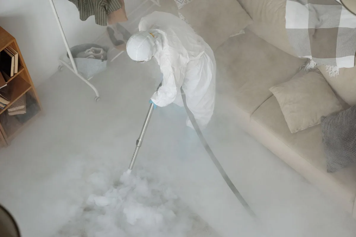 Biohazard cleanup technician in protective equipment, Belmont, New York, NY